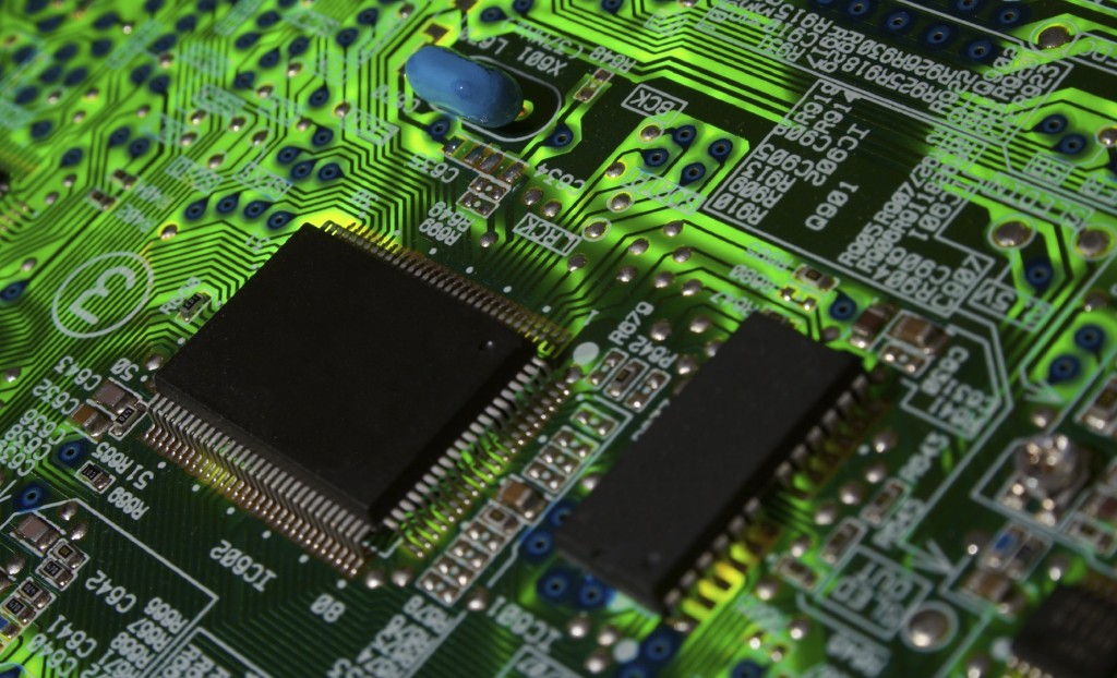 Green electronic board illuminated from bottom